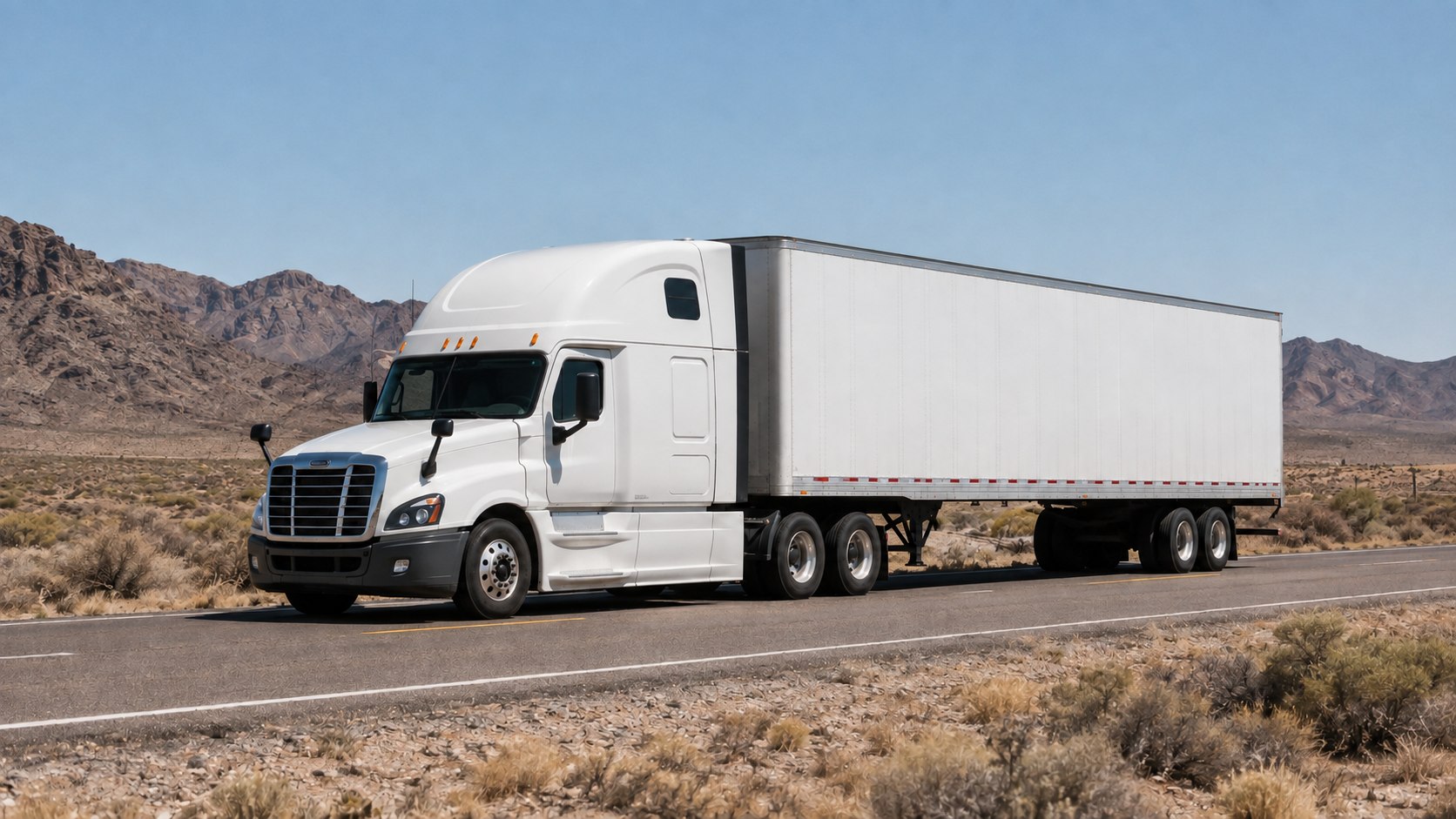 Unbranded white semi-truck traveling on a desert highway